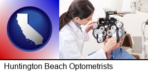 Huntington Beach, California - female optometrist performing a sight test
