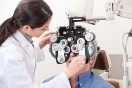 female optometrist performing a sight test