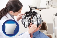 arkansas map icon and female optometrist performing a sight test