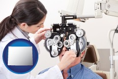 wyoming map icon and female optometrist performing a sight test