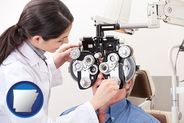 female optometrist performing a sight test - with Arkansas icon