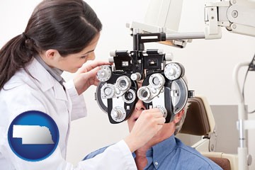 female optometrist performing a sight test - with Nebraska icon