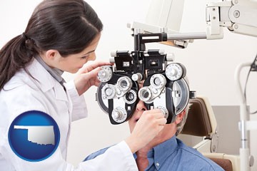 female optometrist performing a sight test - with Oklahoma icon