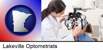 female optometrist performing a sight test in Lakeville, MN